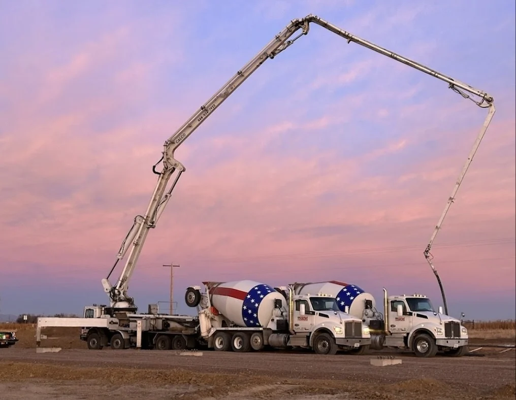 Workers Pouring Foundation Slab With Pump Truck 2
