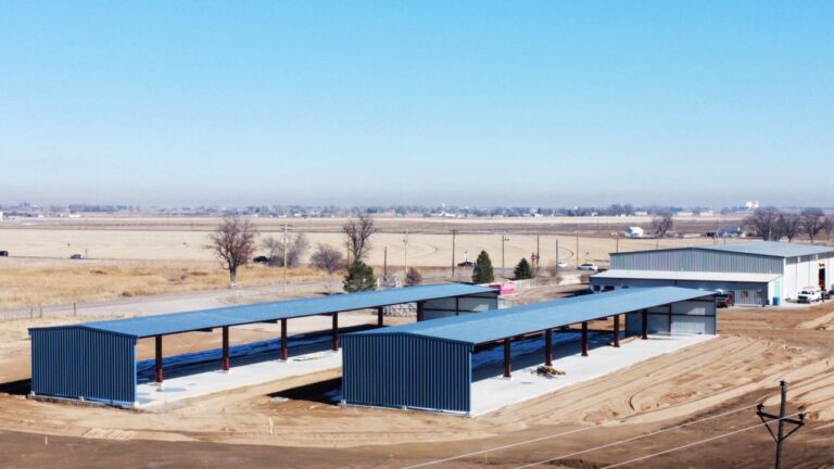 Aerial View Blue Metal Buildings On Slabs